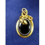 Victorian yellow coloured metal mourning snake style pendant set with black and white banded