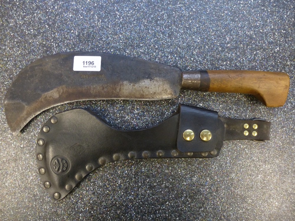 A 1955 Machete by S & J Kitchen: with leather sheath studded to one side