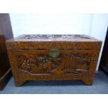 Chinese carved camphor wood blanket box decorated with figures, 101cm