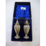 Pair of early 20th Century silver pepperettes, 10cm high, Birmingham 1908 & 1911, approx. 4 troy oz,