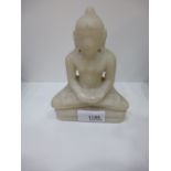 A carved Soapstone Buddha: 14cm high. A German samples velvet lined box containing twelve metal
