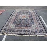 Turkish blue ground carpet with allover floral decoration and central spandrel, 350 x 255cm