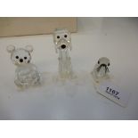 Three Swarovski Crystal ornaments: comprising a Seated Teddy Bear, Seal Pup and a Dog standing on