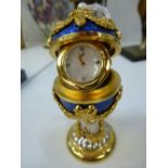 A Franklin mint enamel and gilt Faberge style miniature clock 9cm high