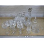 Quantity of cut crystal glassware comprising: 3 decanters, biscuit jar, fruit bowl on pedal base