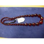 Cherry red amber facetted bead necklace, 38cm long, approx. 107g, please note there are 12 black