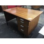 A modern office desk with pedestal of three drawers beneath rectangular top above kneehole.
