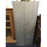 A large steel gun cabinet capable housing 16 guns, fitted with bolts and two Chubb lever locks,