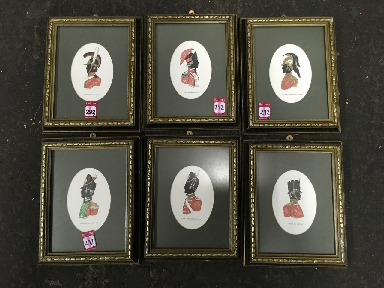 A set of six framed silhouette type prints of nineteenth century military officers, the ovals