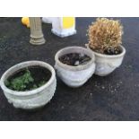 A set of three ribbed composition stone garden plant pots, moulded with swags. (3)