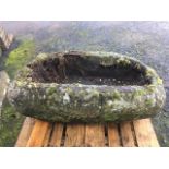 A massive ancient boulder carved as a basin. (39in x 22.5in)