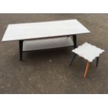 A rectangular painted coffee table with tapering angled legs joined by platform stretcher; and