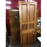 An internal door made by a cabinetmaker with brass handles and hinges, with six moulded panels.