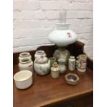 A stoneware studio pottery oil lamp with milk glass shade; and other studio pottery and salt glaze