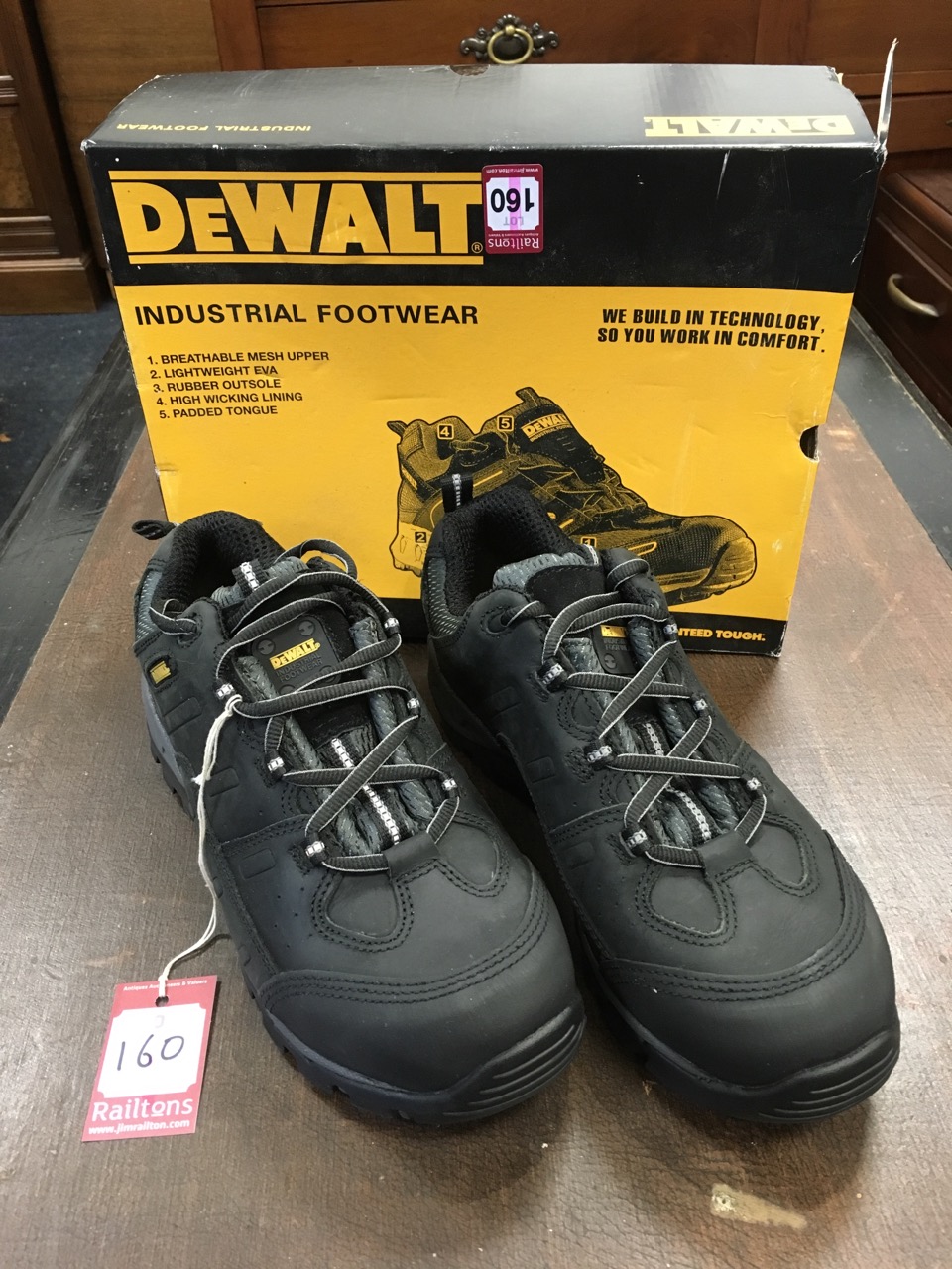 A boxed pair of DeWalt size 9 work boots with metal toe caps, padded tongues, rubber cushion
