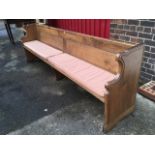 A Victorian dowel jointed oak pew, with twin panelled back above solid plank reeded seat,