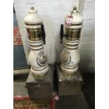 A pair of ceramic beer dispensers for German Macfteiner with gilt metal mounts, fitted on square