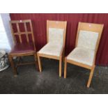 A pair of beech framed dining chairs with upholstered backs & seats; and a 50s oak chair with