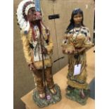 A large Indian chief & his squaw, the handpainted couple in full traditional dress standing on
