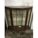 A 'D' shaped walnut china cabinet with gilt decoration to door, raised on cabriole legs.