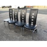 A set of four Italian style leather dining chairs, the shaped backs pierced with rectangles above