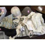 A wartime helmet with liner; a collection of ladies kid gloves - mostly white leather and some dress