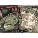 Various ex-army camouflage jackets and vests, etc; and a US army helmet. (14)