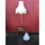 A 60s retro standard lamp with chrome and wood mounts to brass column, above circular tray on