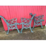 Three cast iron bench ends with scrolled moulded platform arms on channelled legs - lacking