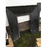 A large Edwardian cast iron fire insert, with plain angled frame. (40in x 40in)