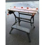 A folding Black & Decker workmate, with vice top, adjustable work surface, step, etc.