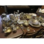 A quantity of silver plate and pewter including teapots, trays, candlesticks, sauceboats, goblets,