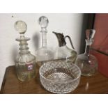 A nineteenth century decanter & stopper with three rings to neck; two engraved glass decanters &