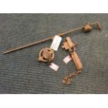 A gamekeepers scarer, with sliding weight on stake; a circular poletrap with serrated jaws; and