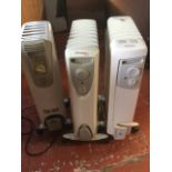 Two Dimplex electric oil filled radiators; and another by DeLonghi. (3)