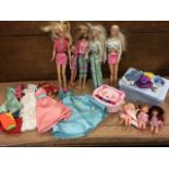 A collection of Barbie dolls with accessories, costumes, baby barbies, etc. (A lot)