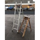 A small set of wood step ladders with four treads; and a folding aluminium ladder in two sections