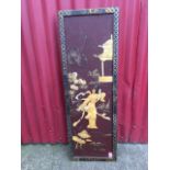 A nineteenth century Japanese lacquered panel set with mother-of-pearl geisha girl, pagoda, flowers,