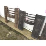 Two nineteenth century cast iron stove fronts with bowfronted bars bordered by foliate embossed