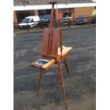 An artists easel & paintbox, the set looks unused with telescopic folding legs, brass mounts,