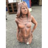 A terracotta coloured composition stone Egyptian lady, the waist figure scantily clad.