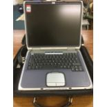 A cased HP Pavilion ze4130 laptop computer.