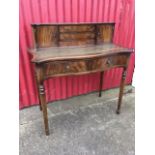 A serpentine fronted mahogany bureau-de-dame, the top with three small drawers flanked by