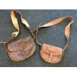 A leather cartridge bag with brass buckle; and another smaller in canvas with leather mounts by