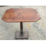 A nineteenth century mahogany occasional table, the rectangular canted top on baluster turned column