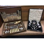 An oak cased canteen of silver plated cutlery, with six settings and some extra pieces; and a