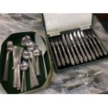 A six-piece set of 60s Viners stainless steel cutlery; a six-piece cased dessert set with leaf