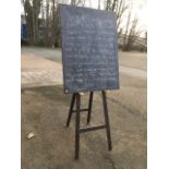 A school style teachers blackboard, with trestle frame and rectangular panelled board with later