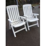 A pair of large folding garden armchairs, with pierced backs & seats on rectangular legs. (2)