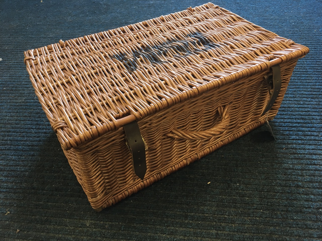 A Fortnum & Mason cane basket with handle & leather straps.